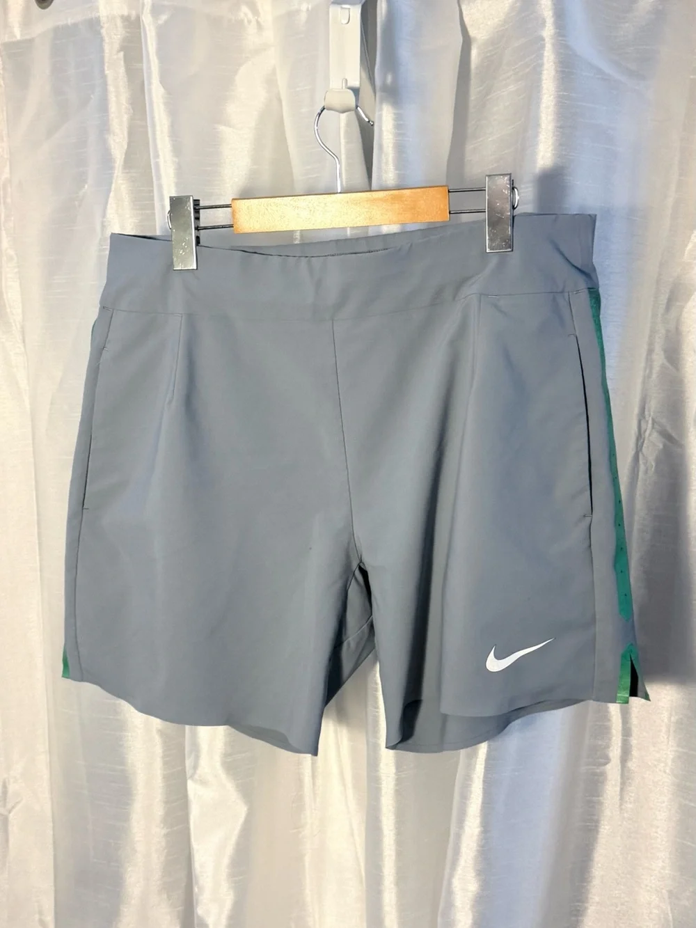 Nike Light Gray Athletic Shorts with Green Side Stripe